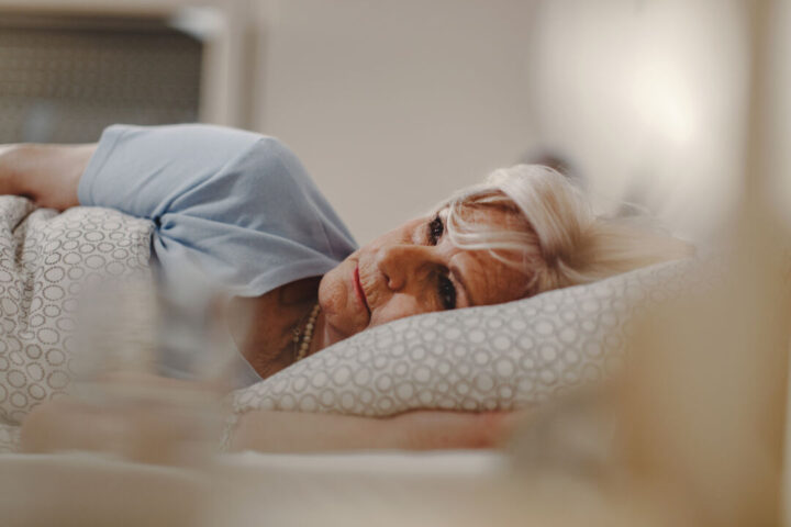 Sleepless mature woman lying in the bed