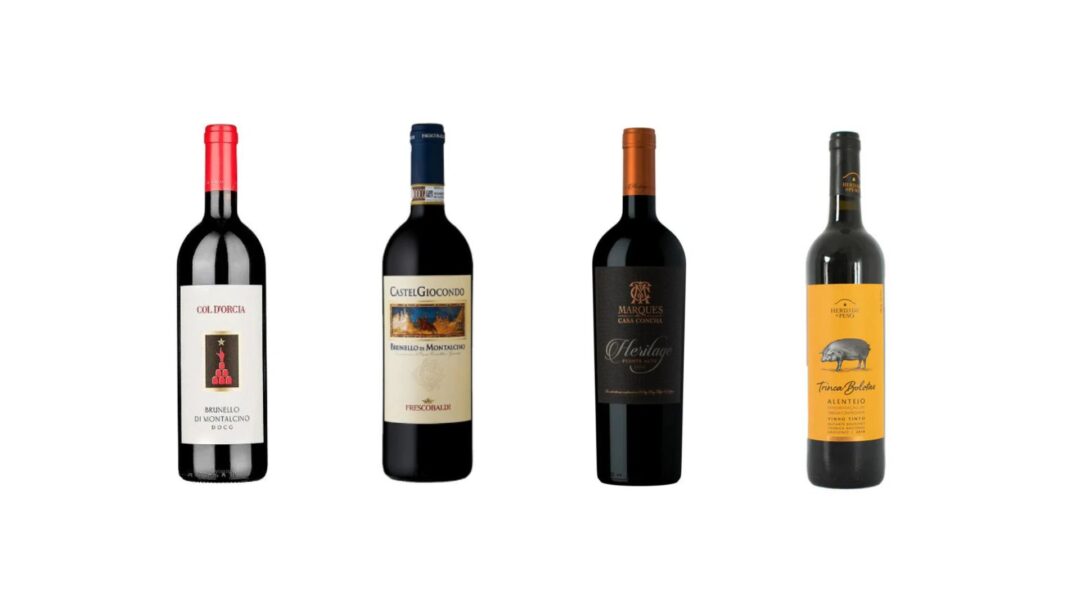 Quatro vinhos selecionados da Wine Trader para a Black November: Col d’Orcia Brunello di Montalcino 2019, Brunello di Montalcino CastelGiocondo 2020, Marques de Casa Concha Heritage 2021 e Trinca Bolotas Tinto Alentejo 2021