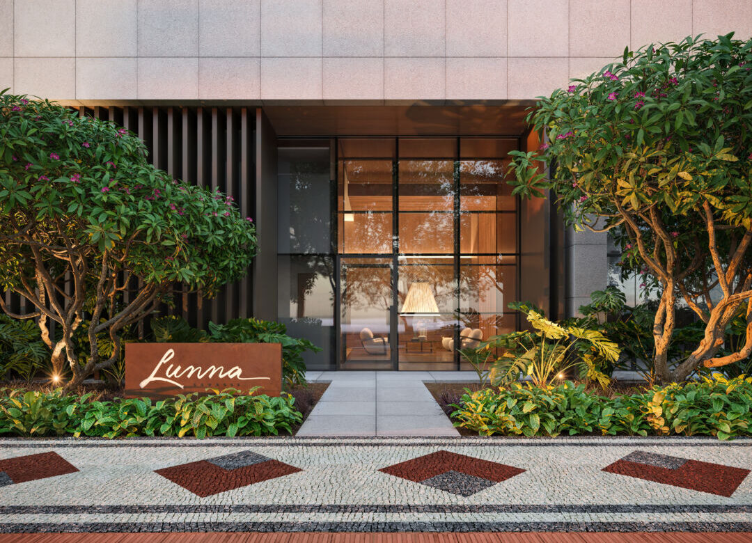 Entrada do empreendimento Lunna Savassi, residencial de alto padrão com fachada moderna e paisagismo em Belo Horizonte