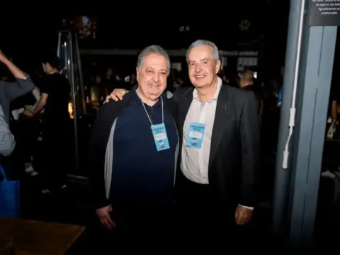 Marco Aurélio Jarjour e Mayrinck Pinto Júnior sorrindo para a foto